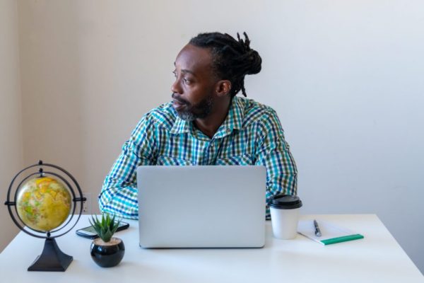 Business Man On Laptop In Virtual Event Breakout Room. 980x653