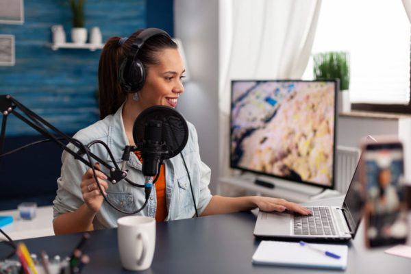 Female Livestreamer Hosting Virtual Webinar. 980x653