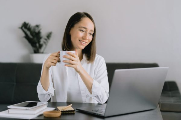 Young Business Women Participating In Live Virtual Event. 980x653